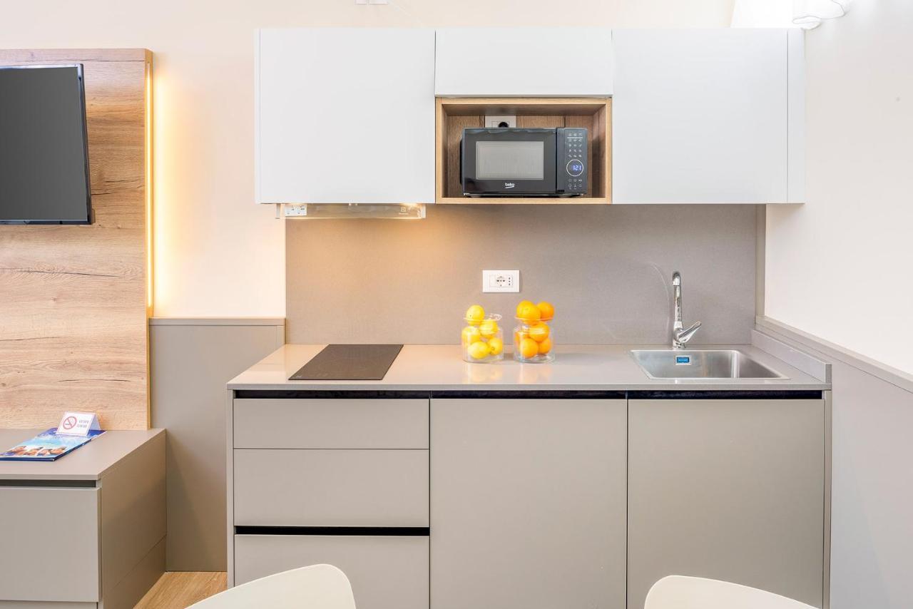 Residenza Panorama Aparthotel Костермано Екстериор снимка